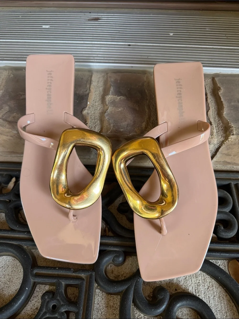 Women’s blush pink thong sandals with gold buckle